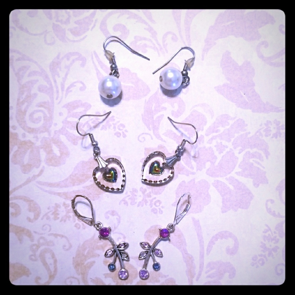 Set of three cream and purple earrings